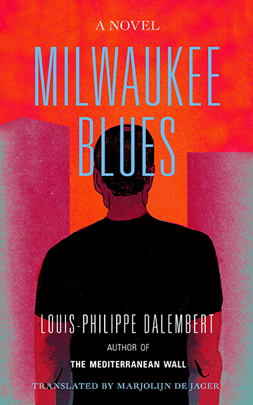 Cover for Milwaukee Blues by Lyonel Trouillot. Translated by Marjolijn de Jager. The cover shows the back of a black man facing two rectangular abstractions which might buildings, with an orange sky. Red light reflects off the buildings and the man's skin.